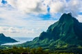 Moorea, French Polynesia: 09/03/2018: Total lanscape of the colorful main mountain in Moorea, everywhere is green and a blue sky Royalty Free Stock Photo