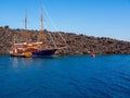 Moored Boat on the Aegean sea. Santorini volcano, Greece