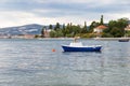 Moored boat. Embankment in Croatia, Kastel Luksic. View of the Adriatic Sea and mountains. Selective focus