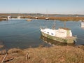 Moored boat in estuary river stream tollesbury essex marsh land