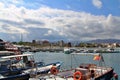 moored boats  bay  Sicilian coast  in the background mountains and hills of various sizes  thick clouds Royalty Free Stock Photo