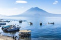 Moored boats, beach & volcanoes, Lake Atitlan, Guatemala