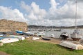 Moored boats and dinghies in Conwy harbour in North Wales UK