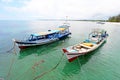 Moored boats at Tanjung Kelayang Beach on Belitung Island.