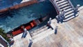 Moored empty venetian gondola on a canal Top view