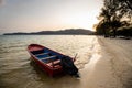 Moored fishing boats at sunset on the sands of a quiet island Royalty Free Stock Photo