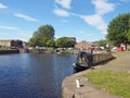 Houseboats and barges at brighouse basin on the calder and hebble navigation canal in calderdale west yorkshire Royalty Free Stock Photo