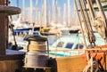 Moored nautical rope on winch on deck of old sailing boat Royalty Free Stock Photo