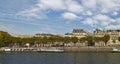 Moored River Barges next to the Stone built banks of the River Seine in Central Paris Royalty Free Stock Photo