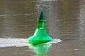 Moored river buoy to show navigation channel for ships Royalty Free Stock Photo