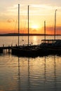 Moored sailboat boats at sunset over lake Steinhuder Meer in Germany