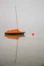 Moored Sailboat in the Fog With Reflection, Lake Constance, Germany Royalty Free Stock Photo