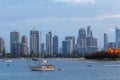 Moored sailboats on Nerang River with high rise buildings in the background. Royalty Free Stock Photo