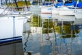 Moored sailboats on a pier calm early morning