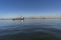 Moored ship. Red boat moored in the calm sea of a bay. Royalty Free Stock Photo