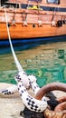 Moored Ship Using Rope and Mooring Knot, Symbol of Serenity and Protection. Royalty Free Stock Photo