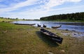 Moored to the shore near the village of long classic wooden boats of the Siberian Mansi people Royalty Free Stock Photo