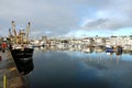 Moored trawlers and fishing equipment. Sutton Harbour Plymouth England