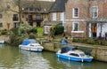Moored-up, private boat seen by a private residence in England. Royalty Free Stock Photo