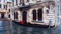 Moored venetian gondola on water canal in Venice Royalty Free Stock Photo