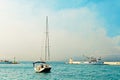 Moored yacht and a fishing trawler in the harbor of a small town called Postira - Croatia, island Brac Royalty Free Stock Photo