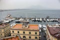 Moored yachtes and boats in port against Vesuvius volcano silhouette. Sailing and shiping concept. Royalty Free Stock Photo