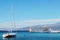 Moored yatch and a fishing trawler in the harbor of a small town Postira - Croatia, island Brac Royalty Free Stock Photo