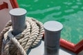 Moorging rope and bollards close up of a tourism boat on the Lake Lugano, Switzerland