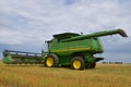 Self Propelled 9770 ST John Deere combine parked in wheat stubble Royalty Free Stock Photo