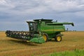Self Propelled 9770 ST John Deere combine parked in wheat stubble Royalty Free Stock Photo