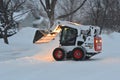 Bobcat skid steer removing snow Royalty Free Stock Photo