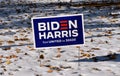 Biden Harris political sign in the snow and leaves