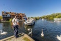 Tourist mooring a hire boat on the Norfolk Broads