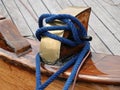 Mooring bollard with blue rope Royalty Free Stock Photo