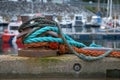 A mooring bollard with colour ropes or hawsers Royalty Free Stock Photo