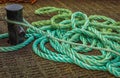 Mooring Bollard with rope on pier by the sea Royalty Free Stock Photo