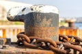 Mooring bollard and rusty anchor chain Royalty Free Stock Photo