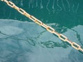 Mooring Chain floating on the surface of the water Royalty Free Stock Photo