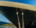 Bow, rat guards and mooring lines of cruise ship tied to dock, Alaska, USA Royalty Free Stock Photo