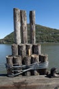 Mooring posts on a river pier Royalty Free Stock Photo