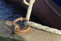 Mooring ring and rope on the quay. Royalty Free Stock Photo