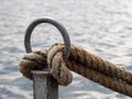 Mooring rope of a boat tied to a bollard. Royalty Free Stock Photo