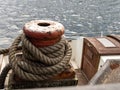 Mooring rope of a boat tied to a bollard. Royalty Free Stock Photo