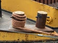 Mooring rope of a boat tied to a bollard. Royalty Free Stock Photo