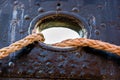 Mooring rope of a large ship standing in the port. Harbor cape w Royalty Free Stock Photo