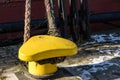 Mooring rope of a large ship standing in the port. Harbor cape w Royalty Free Stock Photo