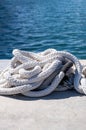 Mooring rope white color on luxury yachts marina pier Royalty Free Stock Photo