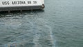 Mooring for the uss arizona and an oil sheen on the surface of the water Royalty Free Stock Photo