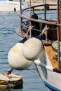 Mooring white buoys on fishing boat