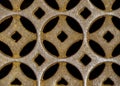 Moorish or Celtic design in repeating circular pattern made of rusted cast iron. Royalty Free Stock Photo